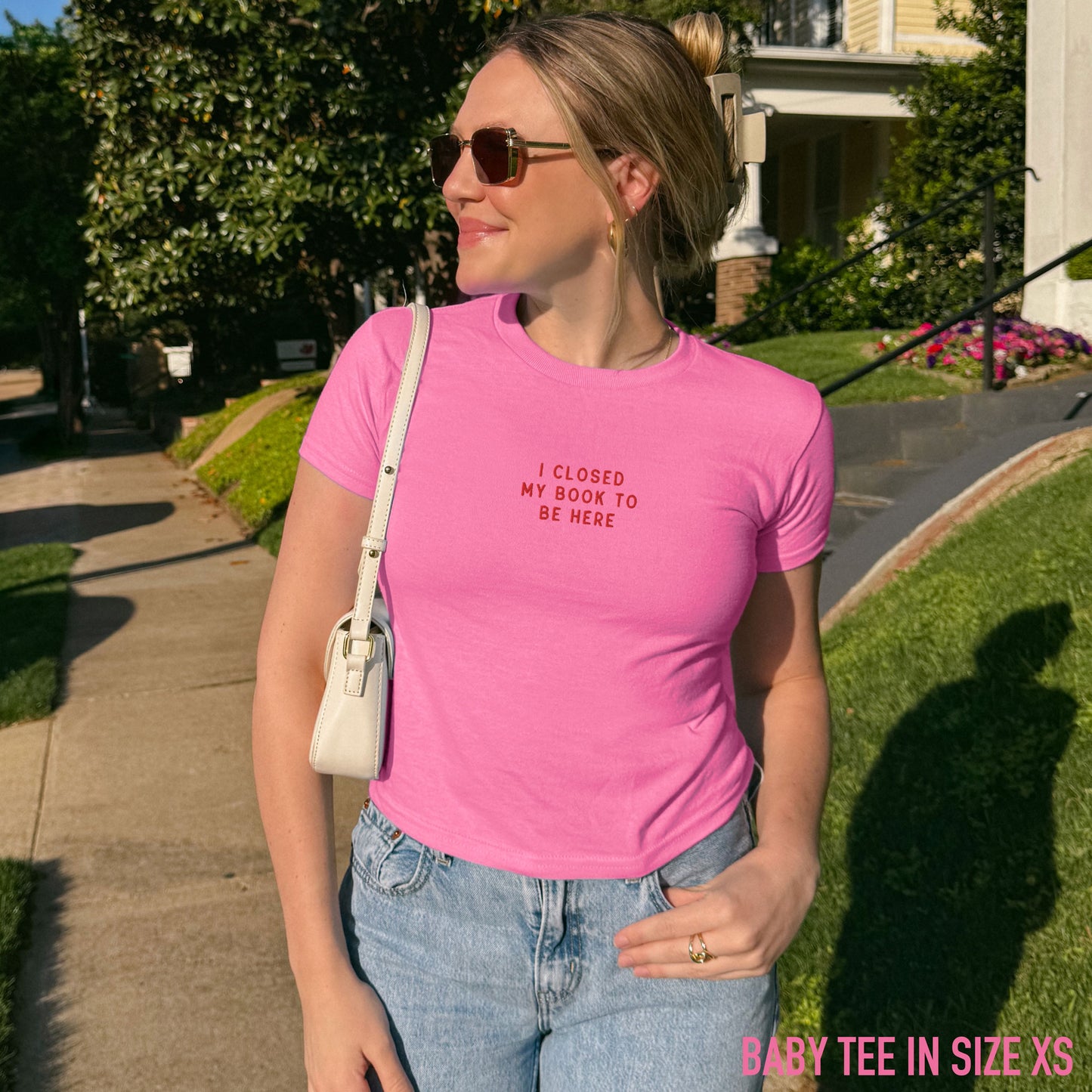 I Closed My Book To Be Here Embroidered Baby Tee