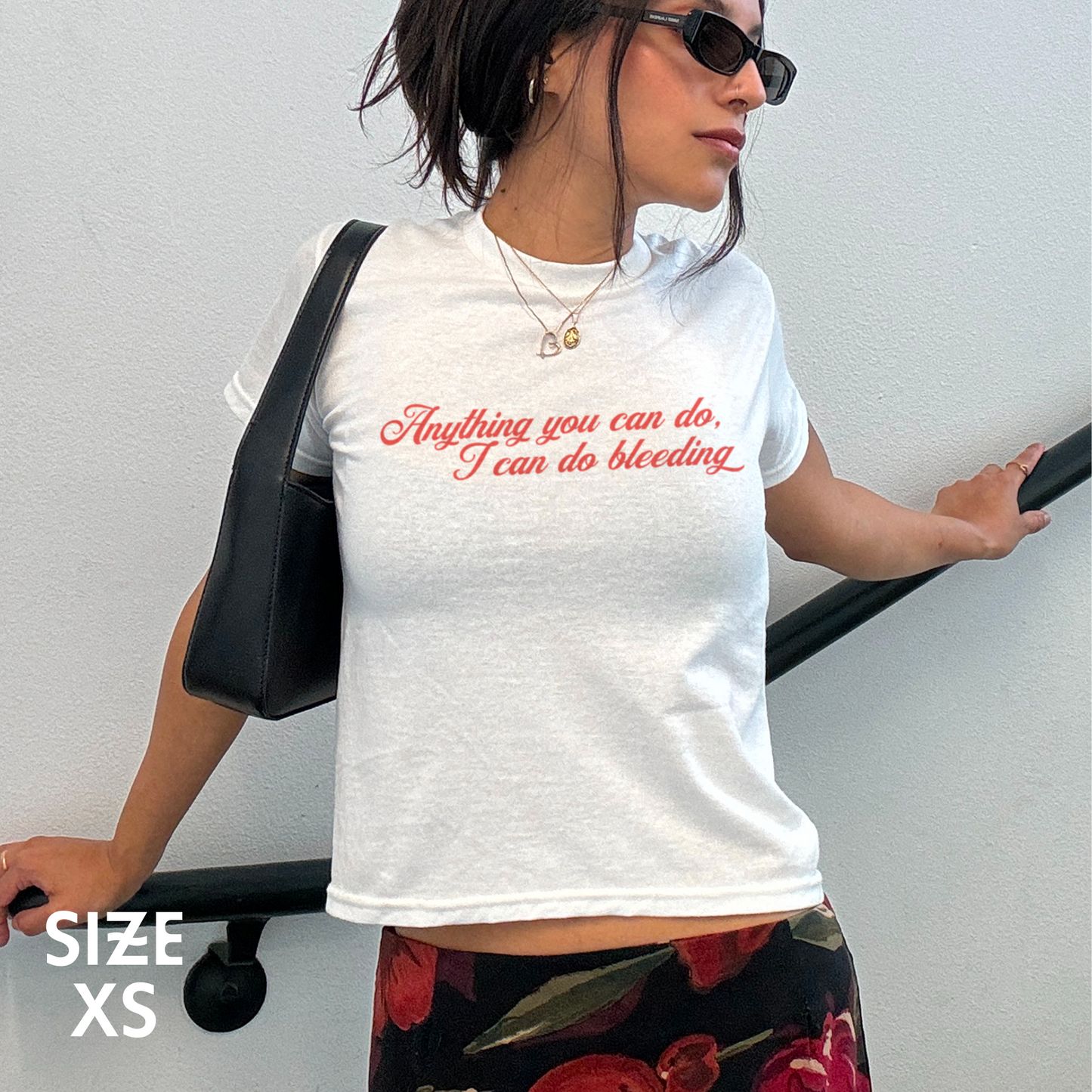 Anything You Can Do, I Can Do Bleeding Feminist Baby Tee